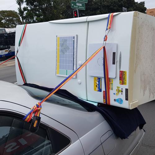 "The Magnets Are Still On The Fridge": Man Straps Fridge To The Boot Of His Car